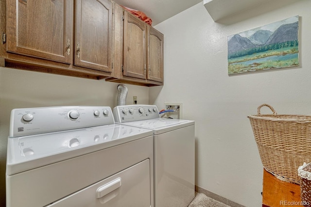 30 Eagle Dr, Littleton, CO 80123 - clothes washing area featuring separate washer and dryer, cabinet space, and baseboards