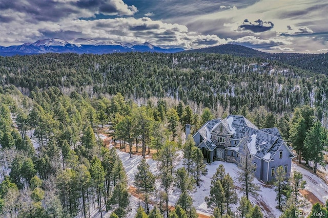 bird's eye view featuring a mountain view and a view of trees