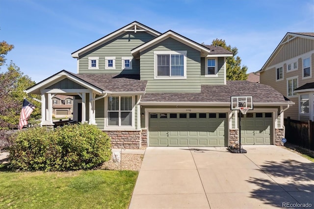 craftsman inspired home with a front lawn and a garage