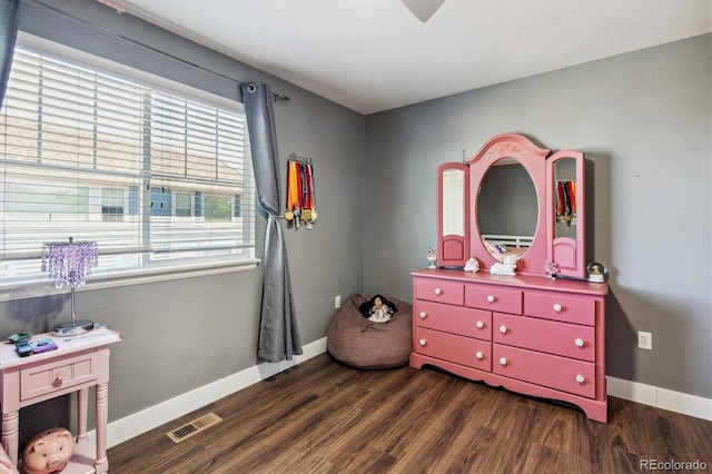 playroom with dark wood-type flooring