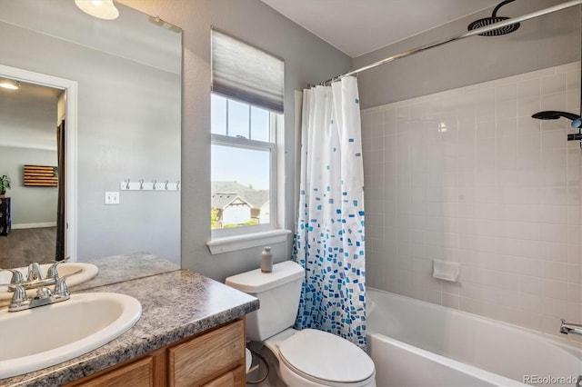 full bathroom featuring toilet, shower / bath combo, and vanity