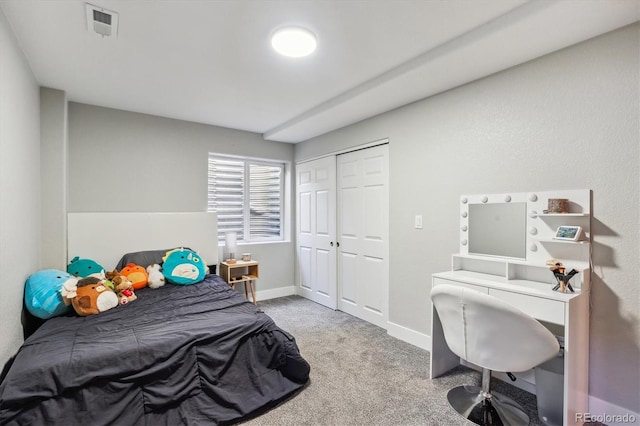 carpeted bedroom with a closet