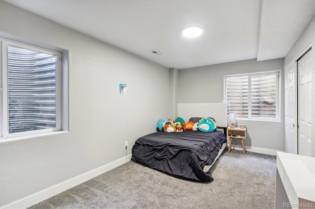 bedroom with a closet and carpet flooring