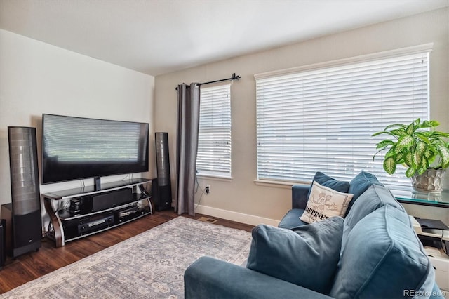 living room with dark hardwood / wood-style floors