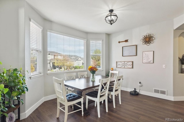 dining room featuring dark hardwood / wood-style flooring