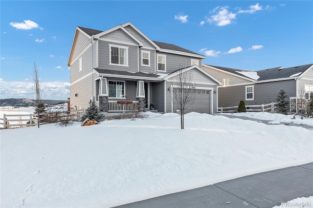 craftsman inspired home featuring a garage and a porch