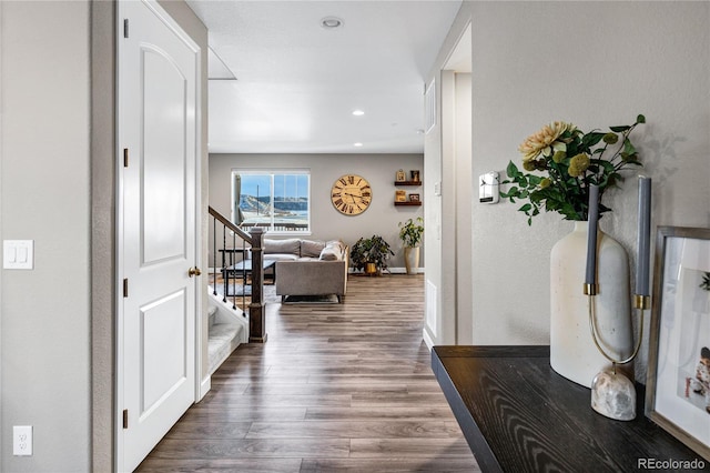 corridor with dark hardwood / wood-style floors