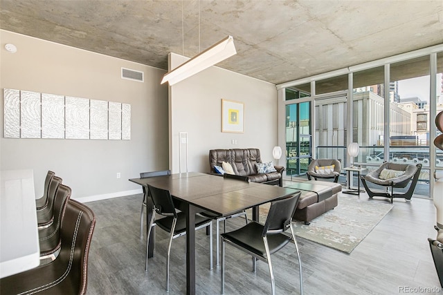 891 14th St Unit 1408, Denver, CO 80202 - dining room featuring wood finished floors and floor to ceiling windows