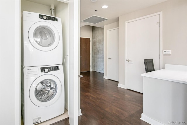 891 14th St Unit 1408, Denver, CO 80202 - laundry area featuring stacked washer and clothes dryer, dark wood-style floors, and recessed lighting