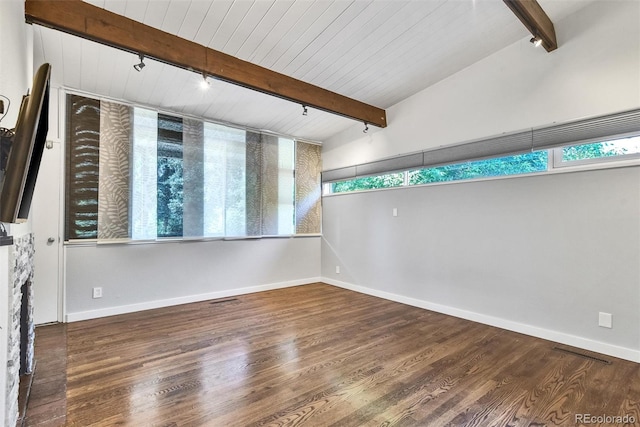 unfurnished living room featuring lofted ceiling with beams, a fireplace, and wood-type flooring