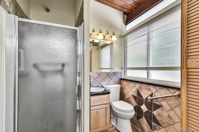 bathroom featuring tile patterned flooring, toilet, vanity, tile walls, and wooden ceiling