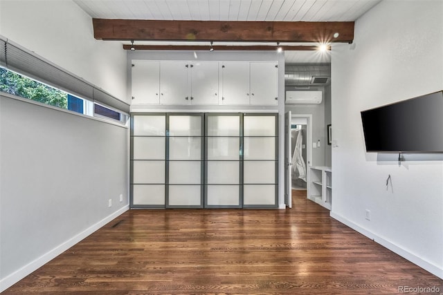 unfurnished living room featuring wooden ceiling, wood-type flooring, and beam ceiling