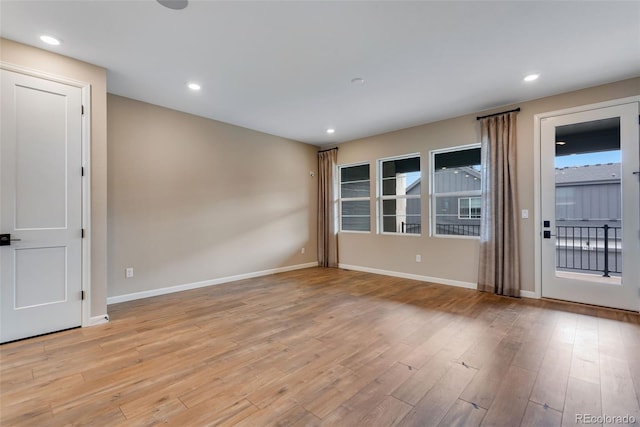 unfurnished room featuring light wood-type flooring