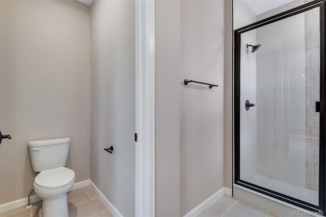 bathroom with tile patterned floors, toilet, and an enclosed shower