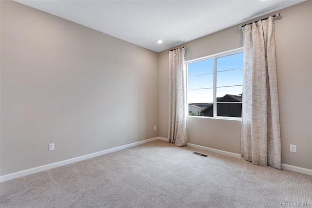 view of carpeted spare room