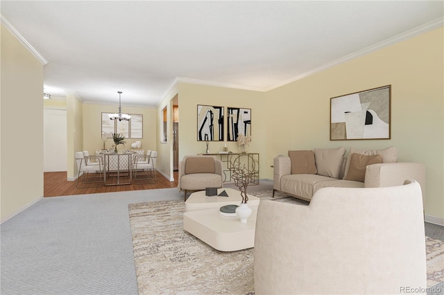 living room with hardwood / wood-style flooring, crown molding, and a notable chandelier