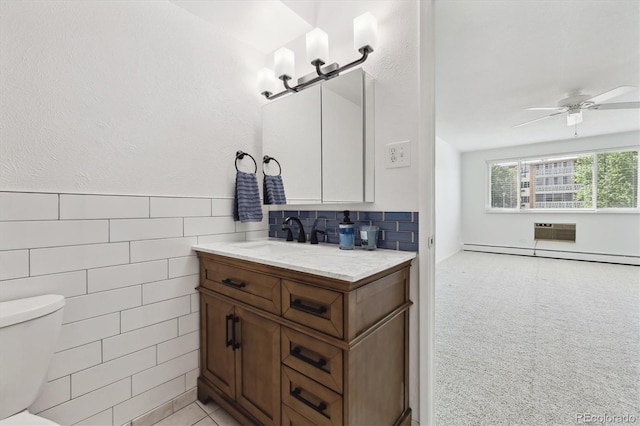 660 S Alton Way Unit 3B, Denver, CO 80247 - half bath with toilet, vanity, a baseboard radiator, a ceiling fan, and an AC wall unit