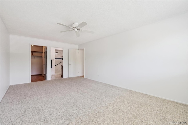660 S Alton Way Unit 3B, Denver, CO 80247 - unfurnished bedroom with carpet floors, a walk in closet, a closet, and ceiling fan