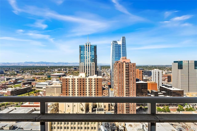 property's view of city featuring a mountain view