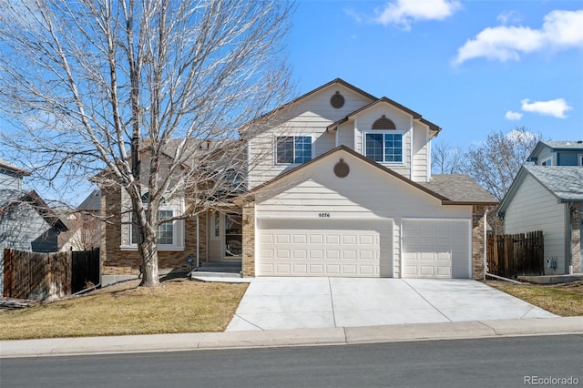 traditional home featuring concrete driveway, brick siding, fence, and an attached garage