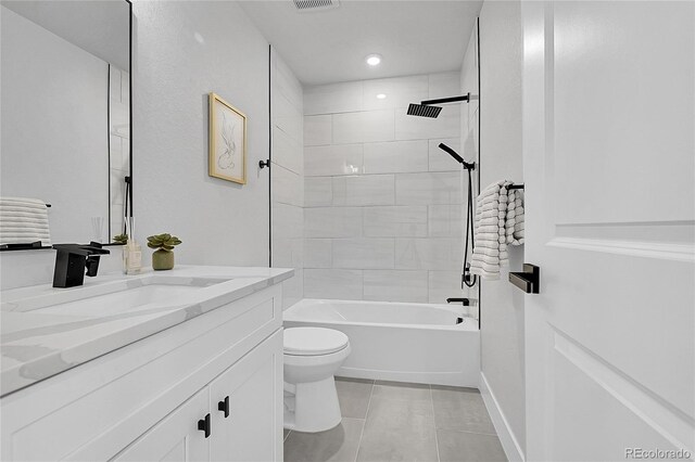 8530 W 52nd Ave Unit A1, Arvada, CO 80002 - bathroom featuring tile patterned flooring, vanity, toilet, shower / tub combination, and baseboards