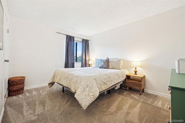 bedroom with carpet floors, a textured ceiling, and baseboards