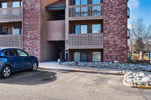 view of property featuring uncovered parking