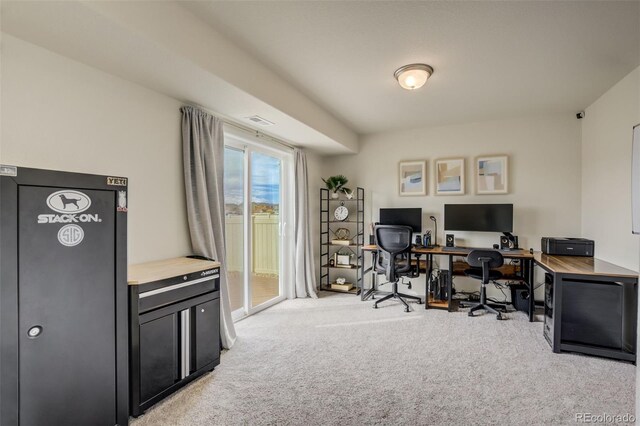 office space featuring visible vents and light colored carpet