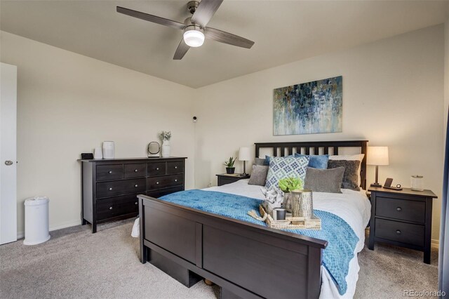 bedroom with carpet flooring, baseboards, and ceiling fan