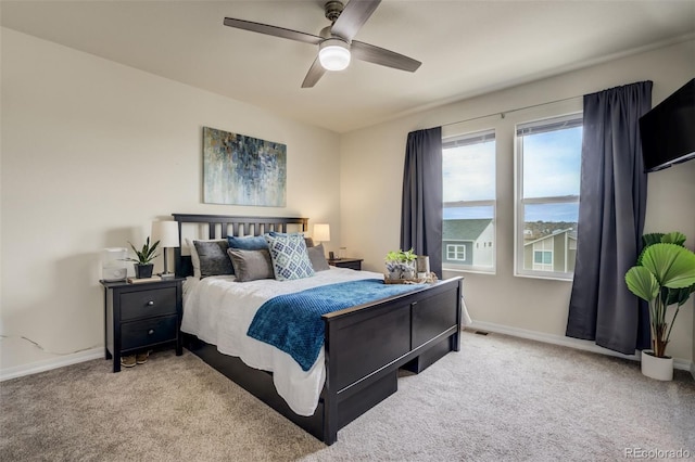bedroom with visible vents, baseboards, carpet, and a ceiling fan