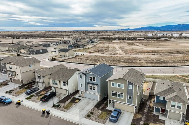 aerial view featuring a mountain view and a residential view