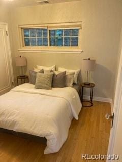 1378 Forest St, Denver, CO 80220 - bedroom featuring wood finished floors and baseboards