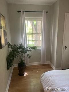 1378 Forest St, Denver, CO 80220 - bedroom featuring baseboards and wood finished floors