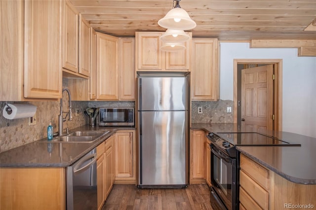 kitchen featuring sink, dark wood-type flooring, hanging light fixtures, stainless steel appliances, and light brown cabinetry