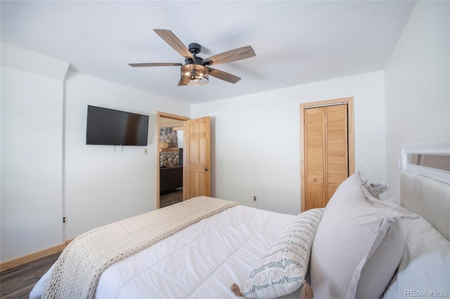 bedroom featuring ceiling fan, a closet, and wood-type flooring