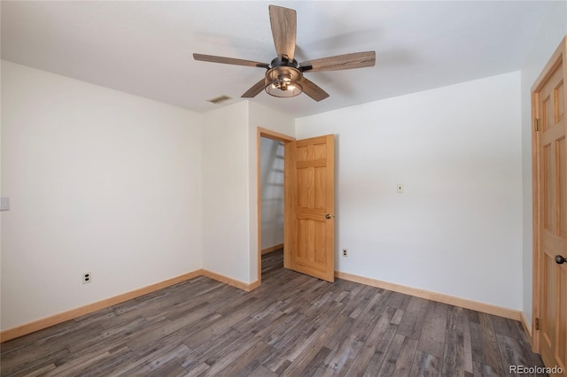 unfurnished bedroom with dark hardwood / wood-style floors and ceiling fan