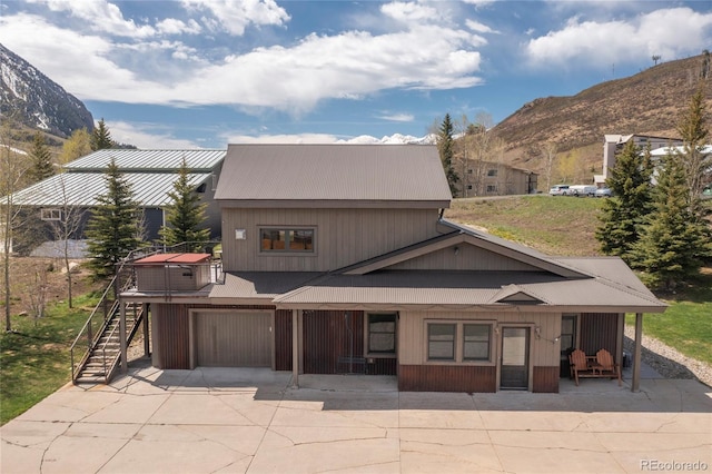 exterior space featuring a mountain view and a garage