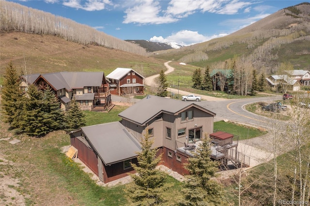 birds eye view of property featuring a mountain view