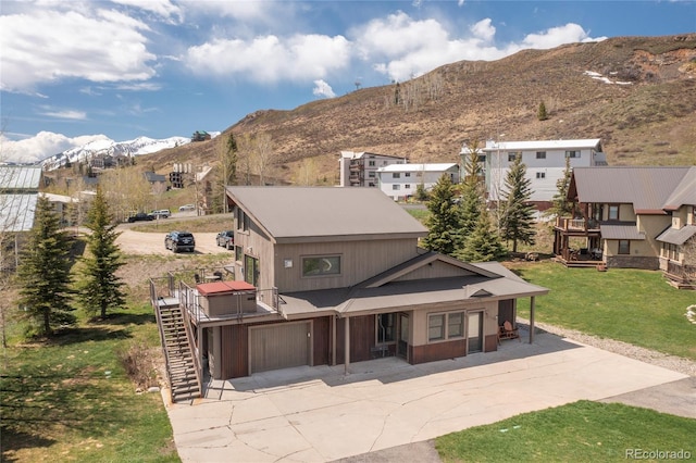 view of front facade featuring a mountain view and a garage