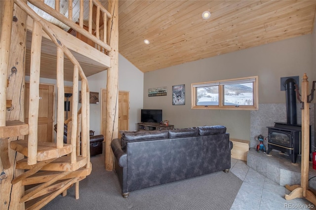 tiled living room featuring wooden ceiling, a wood stove, and vaulted ceiling