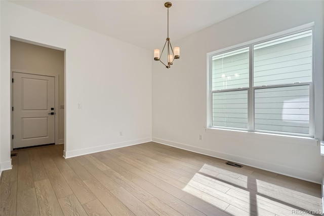 910 Promenade Dr, Superior, CO 80027 - unfurnished room with a chandelier, baseboards, and hardwood / wood-style flooring
