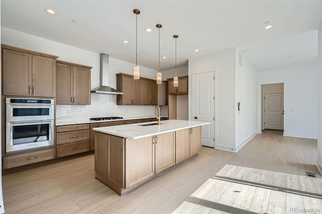 910 Promenade Dr, Superior, CO 80027 - kitchen featuring wall chimney range hood, gas cooktop, a sink, stainless steel double oven, and tasteful backsplash