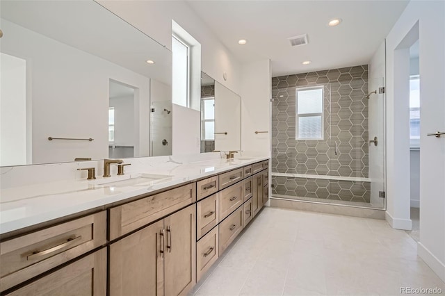 910 Promenade Dr, Superior, CO 80027 - bathroom featuring a shower stall, double vanity, recessed lighting, and tile patterned flooring