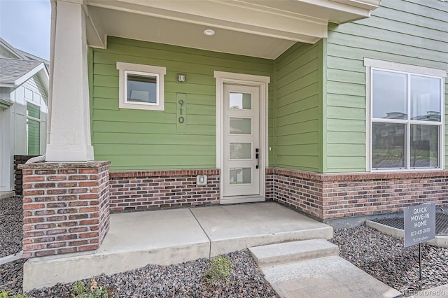 910 Promenade Dr, Superior, CO 80027 - view of exterior entry with brick siding and covered porch