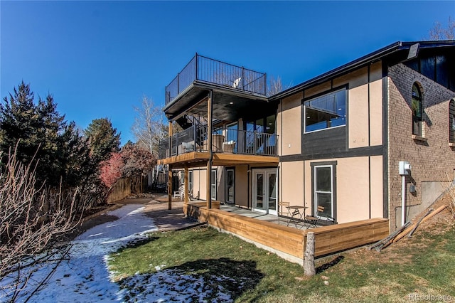 back of house featuring french doors and a patio