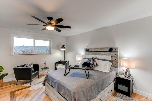 bedroom featuring ceiling fan and hardwood / wood-style flooring