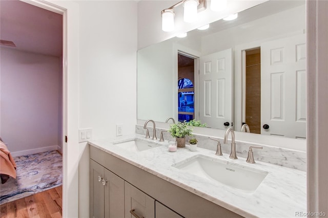 bathroom featuring hardwood / wood-style floors and vanity