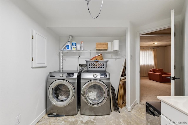943 Reynolds Farm Ln Unit D8, Longmont, CO 80503 - washroom with washer and dryer and baseboards