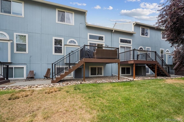 943 Reynolds Farm Ln Unit D8, Longmont, CO 80503 - back of property featuring stairs, a lawn, and a deck