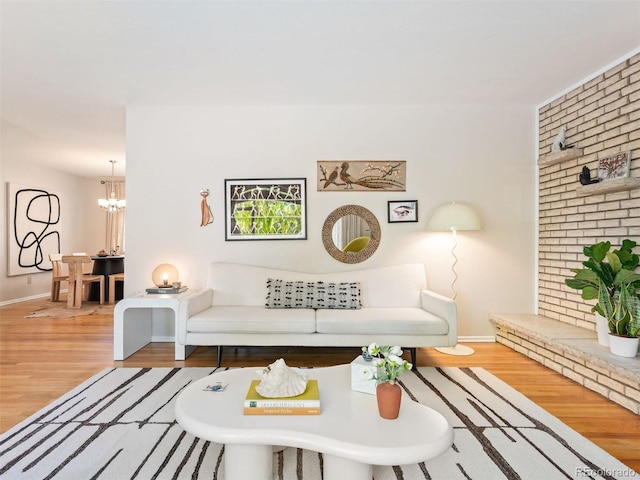 living room featuring light hardwood / wood-style flooring and a chandelier